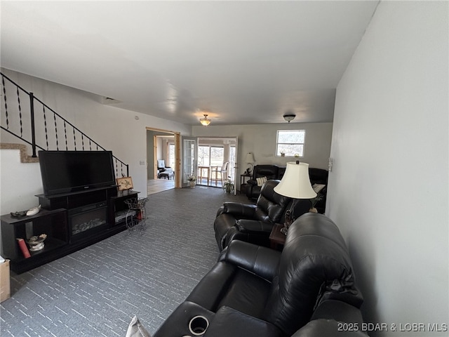 1265 Lick Creek Rd, Edwards, MO 65326 - living room featuring carpet flooring and stairs