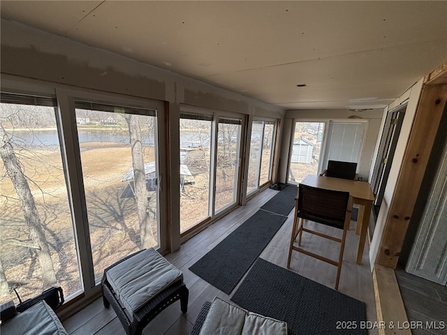 1265 Lick Creek Rd, Edwards, MO 65326 - sunroom / solarium featuring wood finished floors