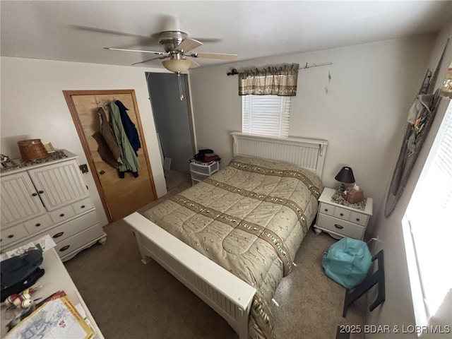 1265 Lick Creek Rd, Edwards, MO 65326 - bedroom with carpet flooring, a closet, and ceiling fan
