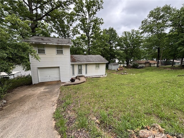 1265 Lick Creek Rd, Edwards, MO 65326 - view of front of house with driveway, a shed, a garage, and a front lawn