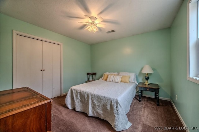 bedroom featuring a closet, carpet, visible vents, and baseboards