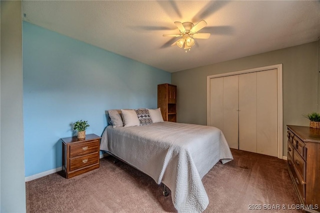 bedroom featuring a closet, baseboards, a ceiling fan, and carpet