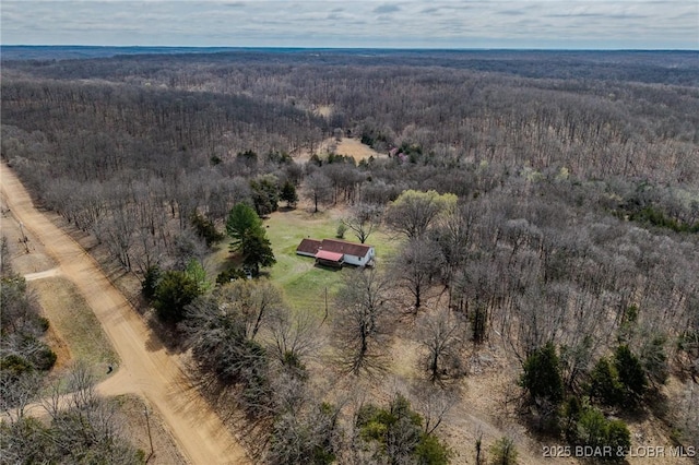 birds eye view of property with a rural view and a view of trees