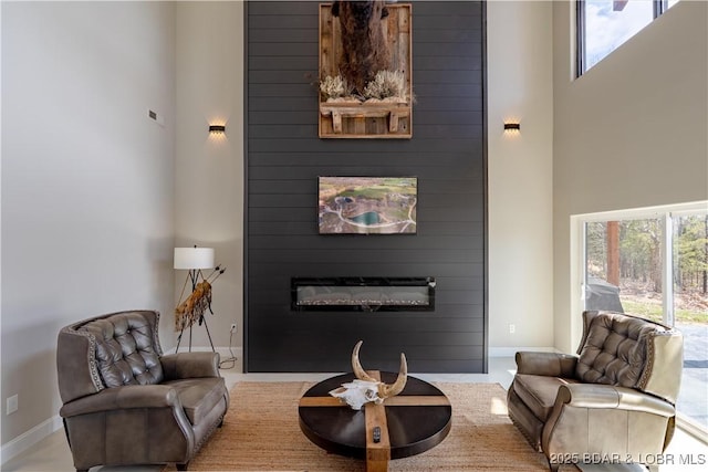 TBD Willow Rd, Eldon, MO 65026 - living area featuring a high ceiling and a large fireplace