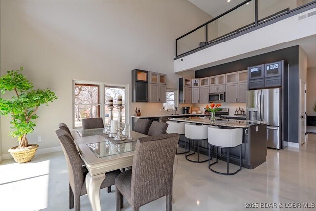 TBD Willow Rd, Eldon, MO 65026 - dining space featuring a high ceiling and baseboards