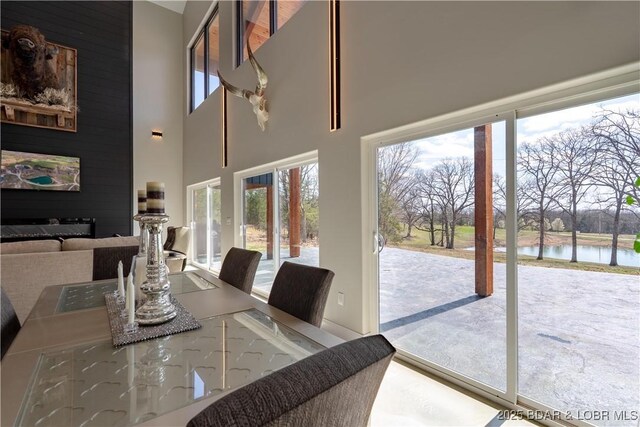 TBD Willow Rd, Eldon, MO 65026 - dining area featuring plenty of natural light, a water view, and a high ceiling