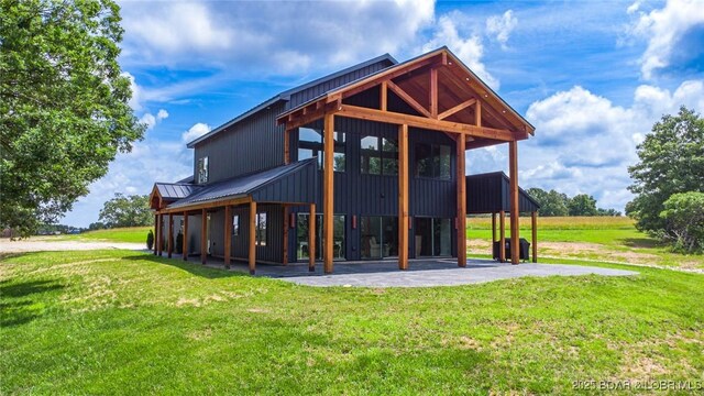 TBD Willow Rd, Eldon, MO 65026 - back of house featuring a lawn and a metal roof
