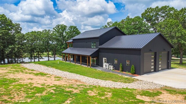 TBD Willow Rd, Eldon, MO 65026 - view of front of house with a front yard and a metal roof