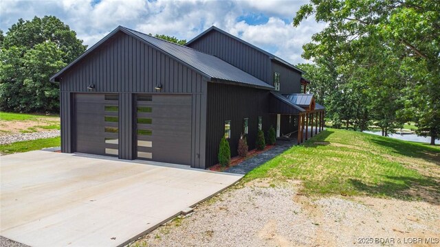 TBD Willow Rd, Eldon, MO 65026 - view of property exterior featuring a metal roof, a water view, and a yard
