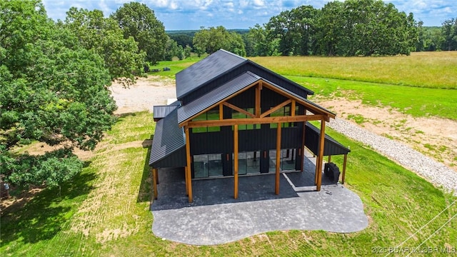 TBD Willow Rd, Eldon, MO 65026 - back of property with a yard, a patio, and a metal roof