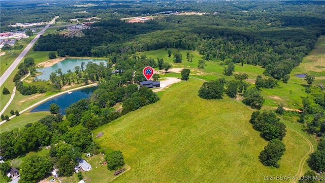TBD Willow Rd, Eldon, MO 65026 - aerial view of property and surrounding area featuring a nearby body of water and a heavily wooded area