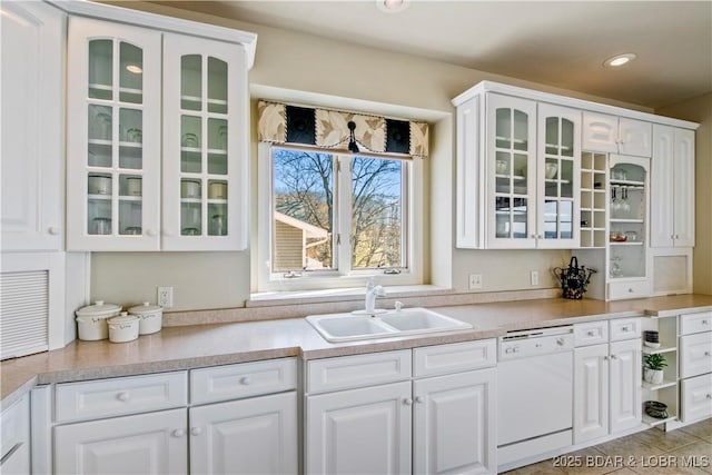1065 Imperial Point Dr, Four Seasons, MO 65049 - kitchen with dishwasher, white cabinets, glass insert cabinets, recessed lighting, and light countertops