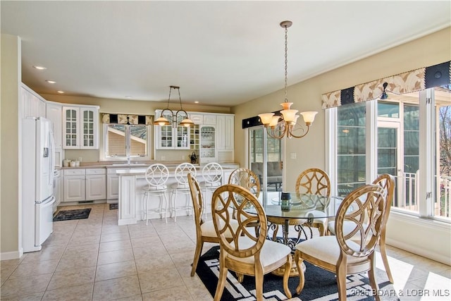 1065 Imperial Point Dr, Four Seasons, MO 65049 - dining space featuring a chandelier, light tile patterned floors, and recessed lighting