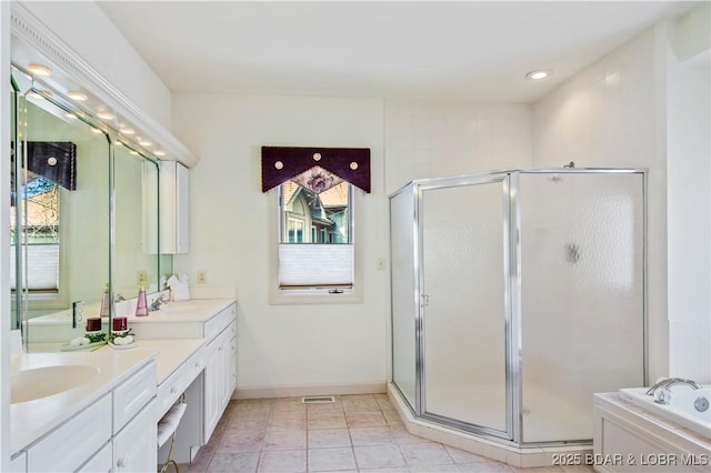 1065 Imperial Point Dr, Four Seasons, MO 65049 - full bathroom featuring healthy amount of natural light, a shower stall, double vanity, and recessed lighting
