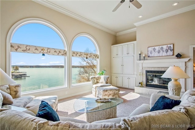 1065 Imperial Point Dr, Four Seasons, MO 65049 - living room featuring a water view, carpet, a ceiling fan, ornamental molding, and a fireplace