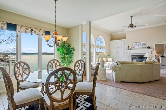1065 Imperial Point Dr, Four Seasons, MO 65049 - dining room featuring light tile patterned floors, a chandelier, a ceiling fan, a water view, and crown molding