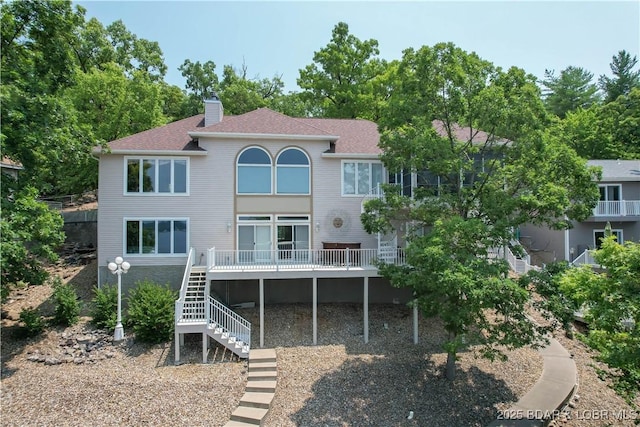 1065 Imperial Point Dr, Four Seasons, MO 65049 - rear view of house featuring stairs, a chimney, a deck, and roof with shingles