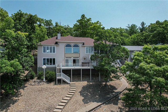 1065 Imperial Point Dr, Four Seasons, MO 65049 - rear view of property featuring stairs, a chimney, a deck, and a shingled roof