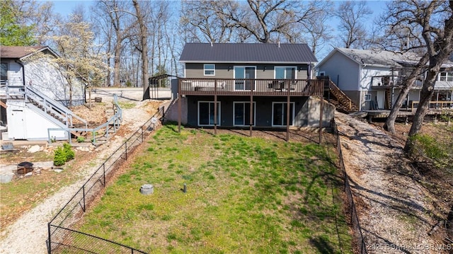 1636 Carol Rd, Lake Ozark, MO 65049 - rear view of property with stairs, a wooden deck, metal roof, and a fenced backyard