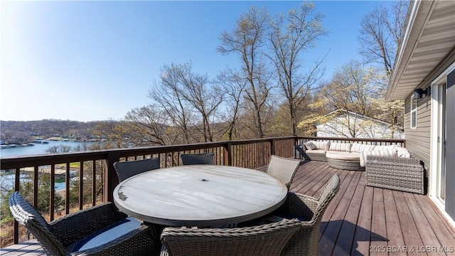 1636 Carol Rd, Lake Ozark, MO 65049 - deck featuring outdoor dining area and a water view