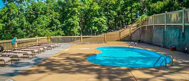 2500 Bay Point Ln Unit 135, Osage Beach, MO 65065 - view of swimming pool with a fenced backyard, a fenced in pool, and a patio area