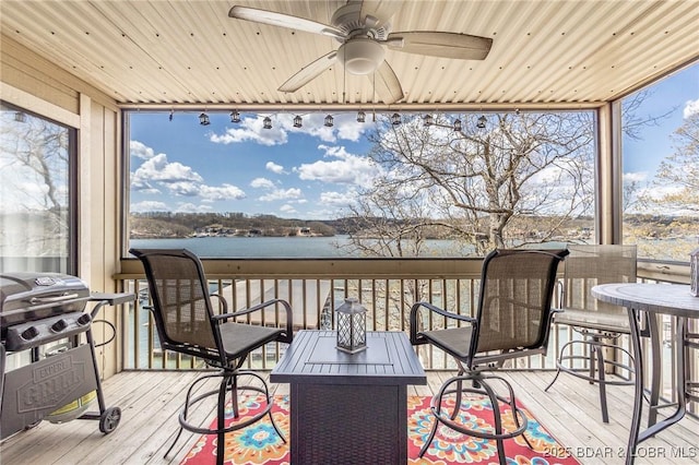 2500 Bay Point Ln Unit 135, Osage Beach, MO 65065 - deck featuring area for grilling, a ceiling fan, and a water view