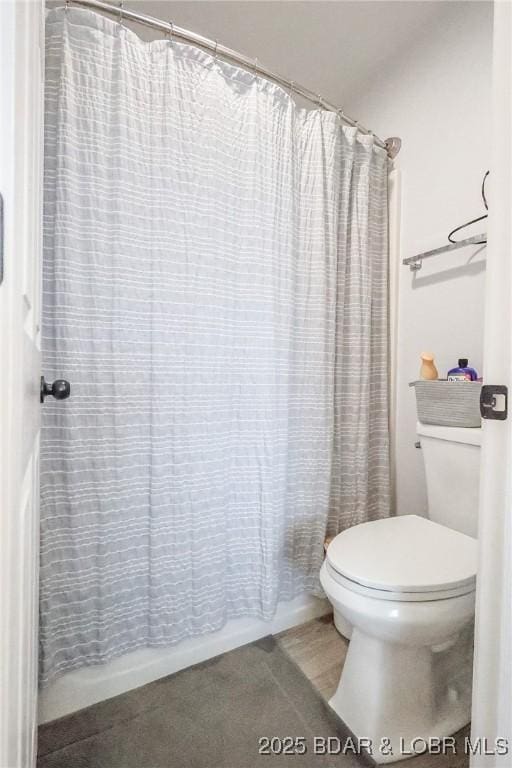 2500 Bay Point Ln Unit 135, Osage Beach, MO 65065 - bathroom with toilet and shower / bathtub combination with curtain