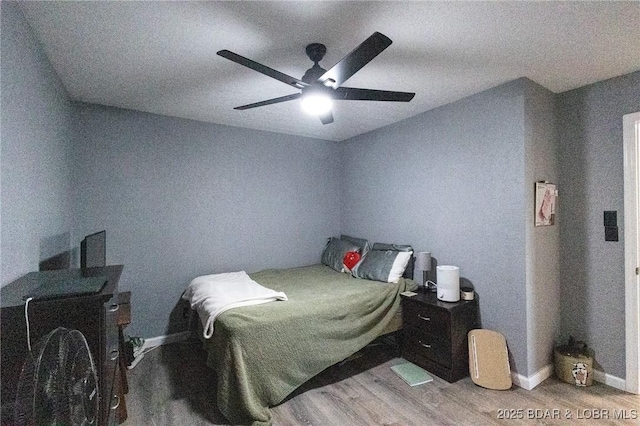 2500 Bay Point Ln Unit 135, Osage Beach, MO 65065 - bedroom with a ceiling fan and wood finished floors