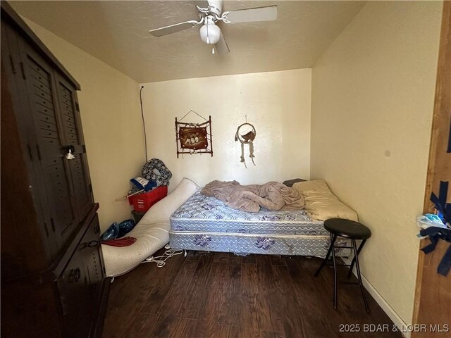 24431 Scenic Ridge Rd, Barnett, MO 65011 - bedroom with wood finished floors and ceiling fan