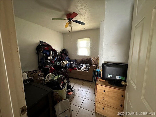bedroom with light tile patterned floors and a ceiling fan