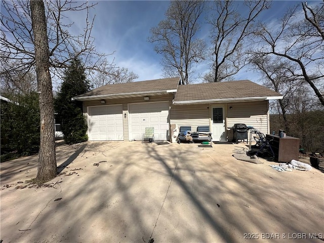 garage featuring driveway
