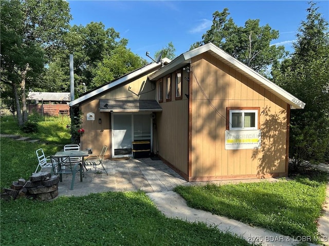 24431 Scenic Ridge Rd, Barnett, MO 65011 - rear view of house featuring a patio area