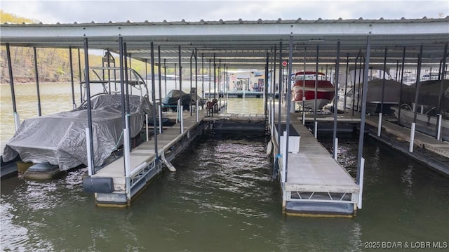 875 Parkside Pl Unit B304, Osage Beach, MO 65020 - view of dock with a water view and boat lift