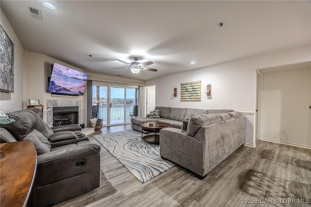 251 Vision Dr Unit 1D, Camdenton, MO 65020 - living area featuring ceiling fan, visible vents, recessed lighting, wood finished floors, and a high end fireplace