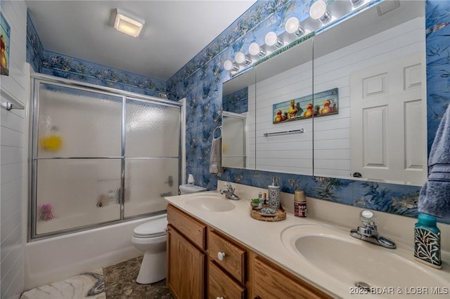 251 Vision Dr Unit 1D, Camdenton, MO 65020 - bathroom featuring a sink, toilet, shower / bath combination with glass door, and wallpapered walls