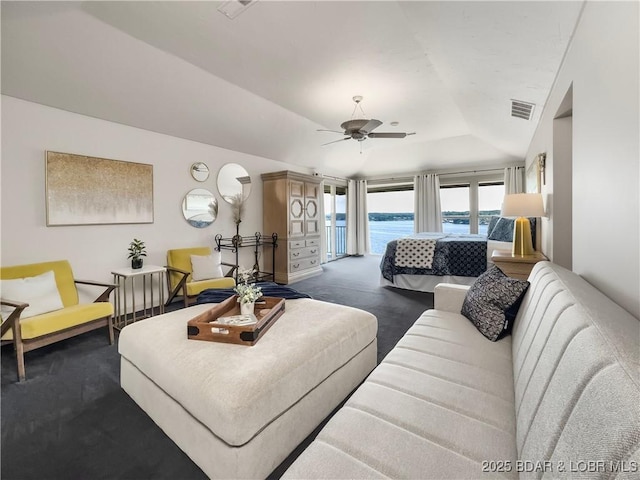 16 Hawk Hill Ct, Lake Ozark, MO 65049 - living area featuring dark carpet, a ceiling fan, vaulted ceiling, and a raised ceiling