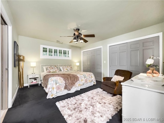 16 Hawk Hill Ct, Lake Ozark, MO 65049 - bedroom featuring multiple closets, baseboards, dark carpet, and a ceiling fan