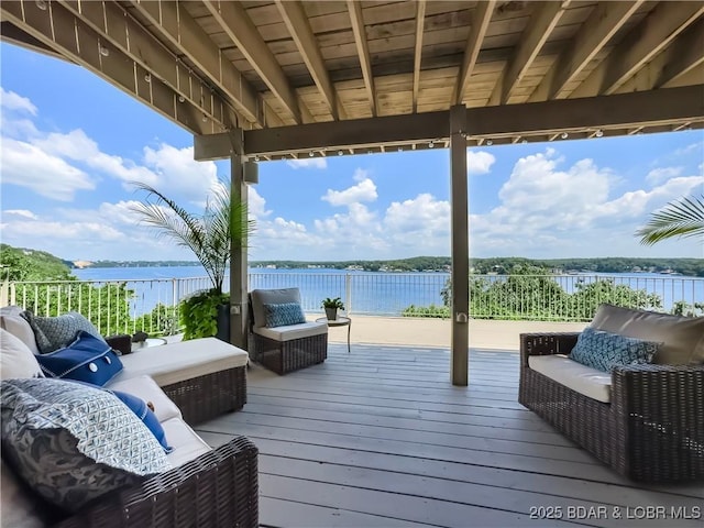 16 Hawk Hill Ct, Lake Ozark, MO 65049 - wooden deck with an outdoor living space and a water view