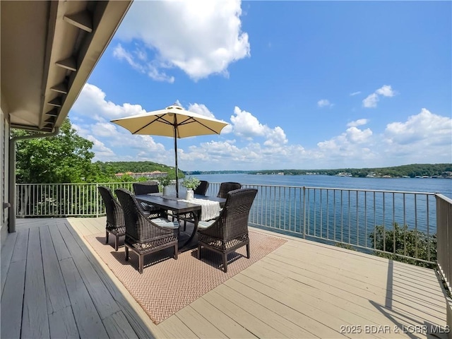 16 Hawk Hill Ct, Lake Ozark, MO 65049 - wooden deck featuring a water view and outdoor dining area