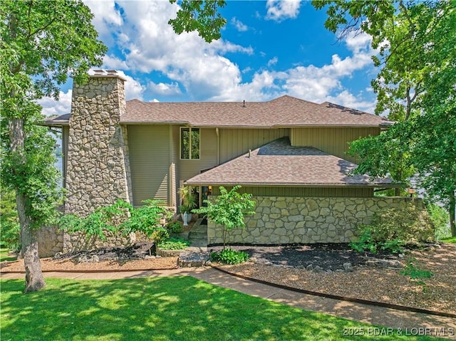 16 Hawk Hill Ct, Lake Ozark, MO 65049 - view of property exterior featuring a shingled roof, a chimney, and a lawn