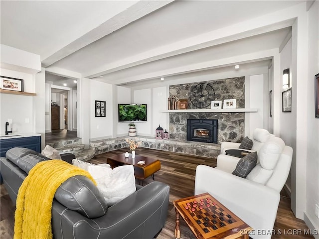 16 Hawk Hill Ct, Lake Ozark, MO 65049 - living room featuring wood finished floors, a stone fireplace, and beam ceiling