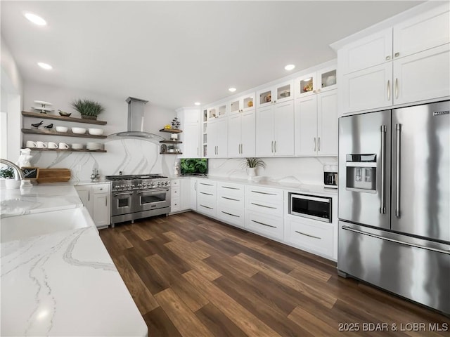 16 Hawk Hill Ct, Lake Ozark, MO 65049 - kitchen featuring high end appliances, open shelves, range hood, dark wood-type flooring, and recessed lighting
