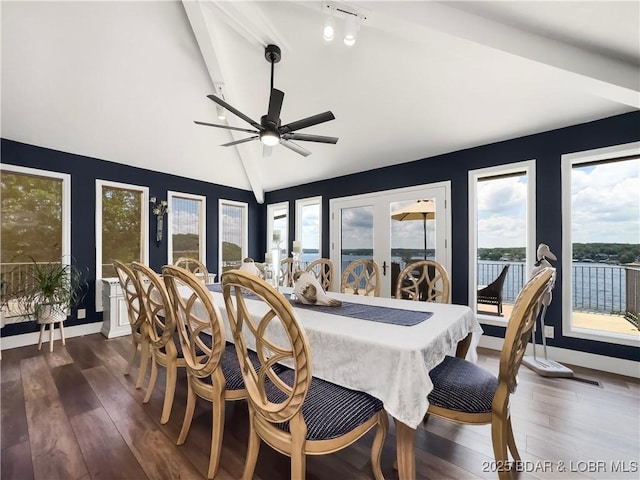 16 Hawk Hill Ct, Lake Ozark, MO 65049 - dining room with lofted ceiling, a ceiling fan, dark wood finished floors, and baseboards