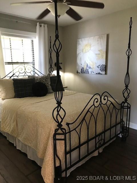 16 Hawk Hill Ct, Lake Ozark, MO 65049 - bedroom featuring wood finished floors, a ceiling fan, and baseboards