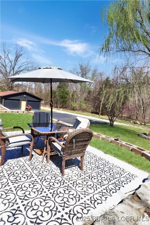 83 Archer Dr, Camdenton, MO 65020 - view of patio / terrace featuring an outbuilding and outdoor dining area