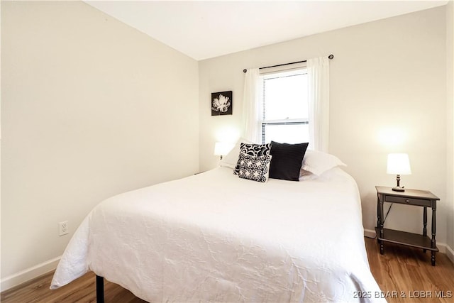 83 Archer Dr, Camdenton, MO 65020 - bedroom with wood finished floors and baseboards