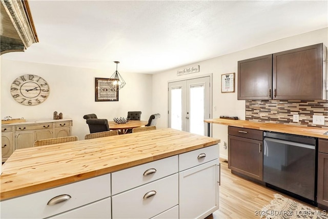 83 Archer Dr, Camdenton, MO 65020 - kitchen featuring french doors, light wood-style flooring, backsplash, butcher block counters, and stainless steel dishwasher