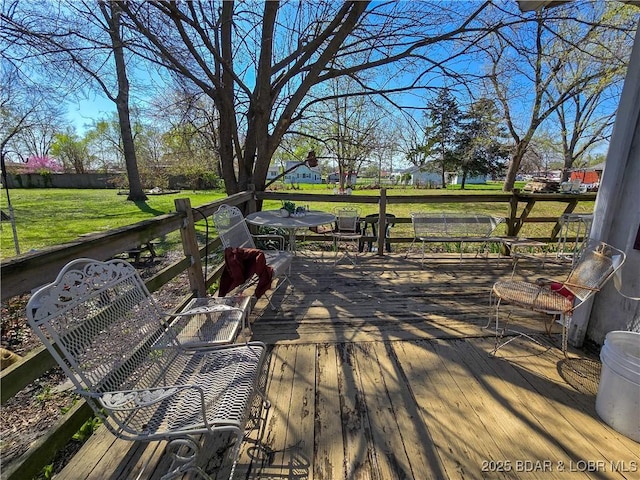 207 S Maple St, Versailles, MO 65084 - wooden terrace featuring a lawn