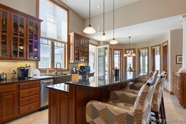 406 N Point Dr, Camdenton, MO 65020 - kitchen featuring dishwasher, light tile patterned floors, decorative backsplash, a breakfast bar area, and recessed lighting