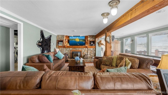 living area featuring crown molding, beamed ceiling, and a fireplace